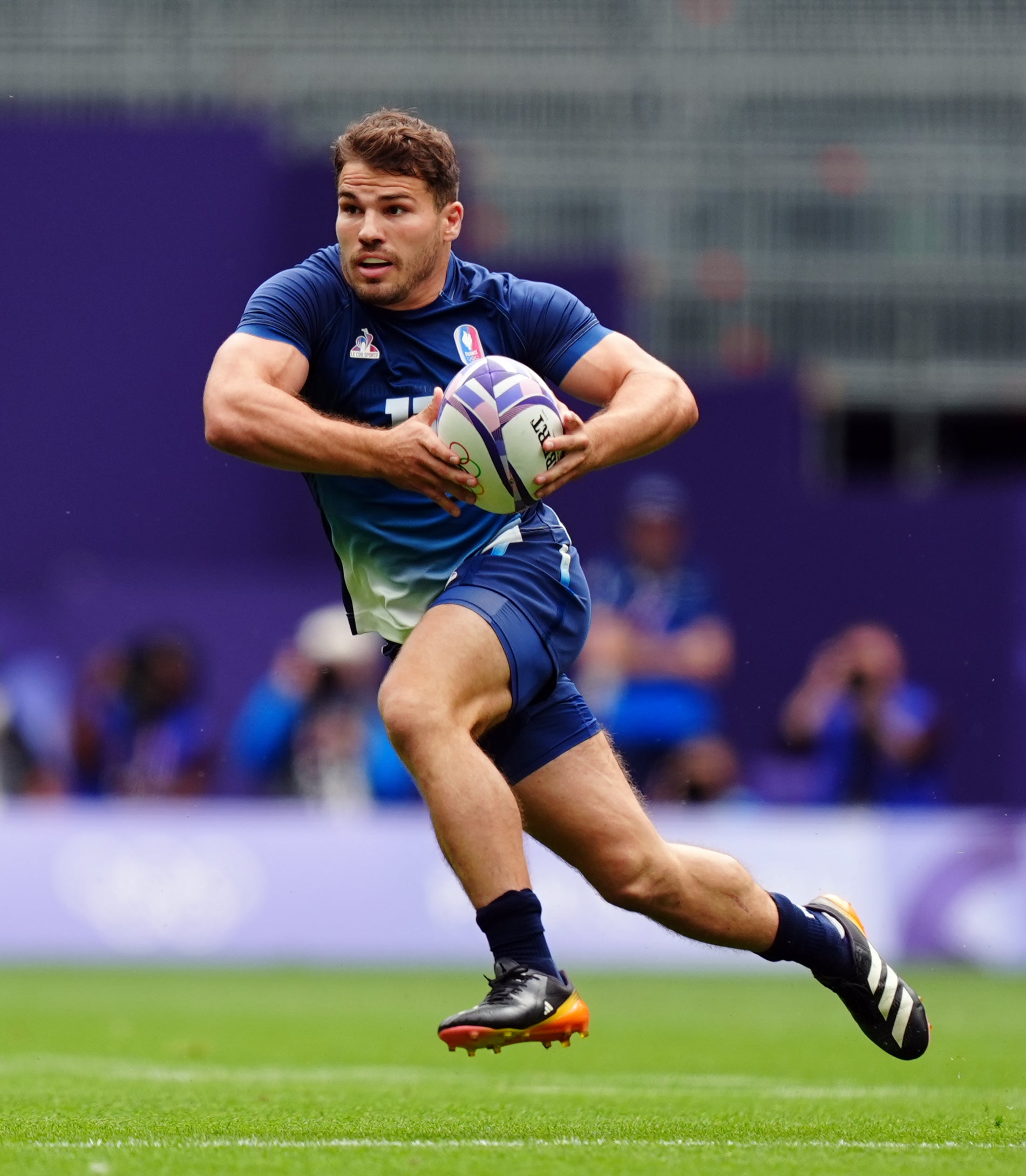 Antoine Dupont runs with the ball for France (Mike Egerton/PA)