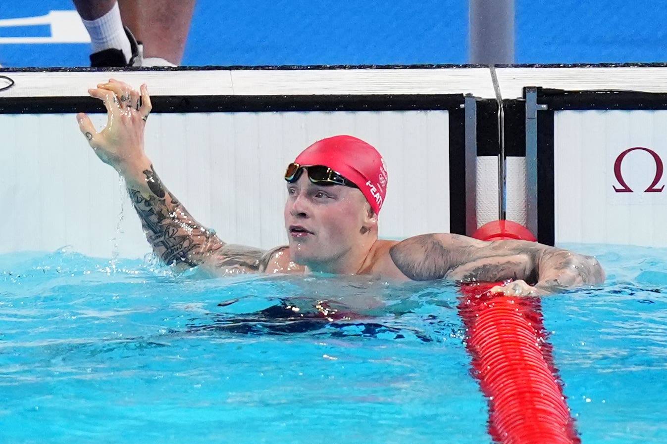 Adam Peaty won his heat as he started the defence of his Olympic men’s 100 metres breaststroke title