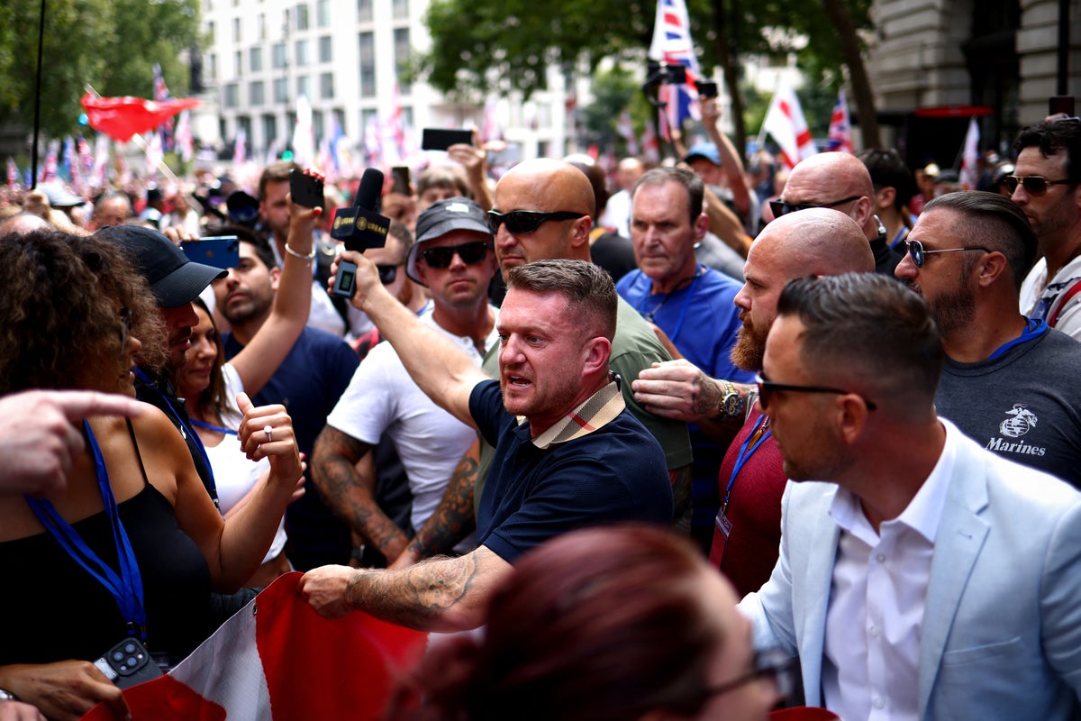 Two men arrested at Tommy Robinson march in London after clash with anti-racism protester