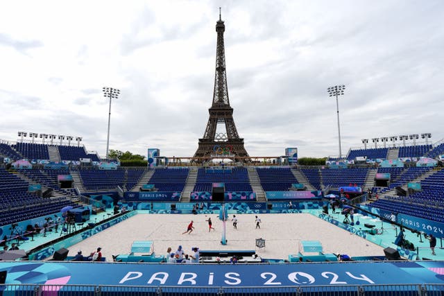 Dark clouds hovered over the opening day of the beach volleyball competition in Paris (David Davies/PA)