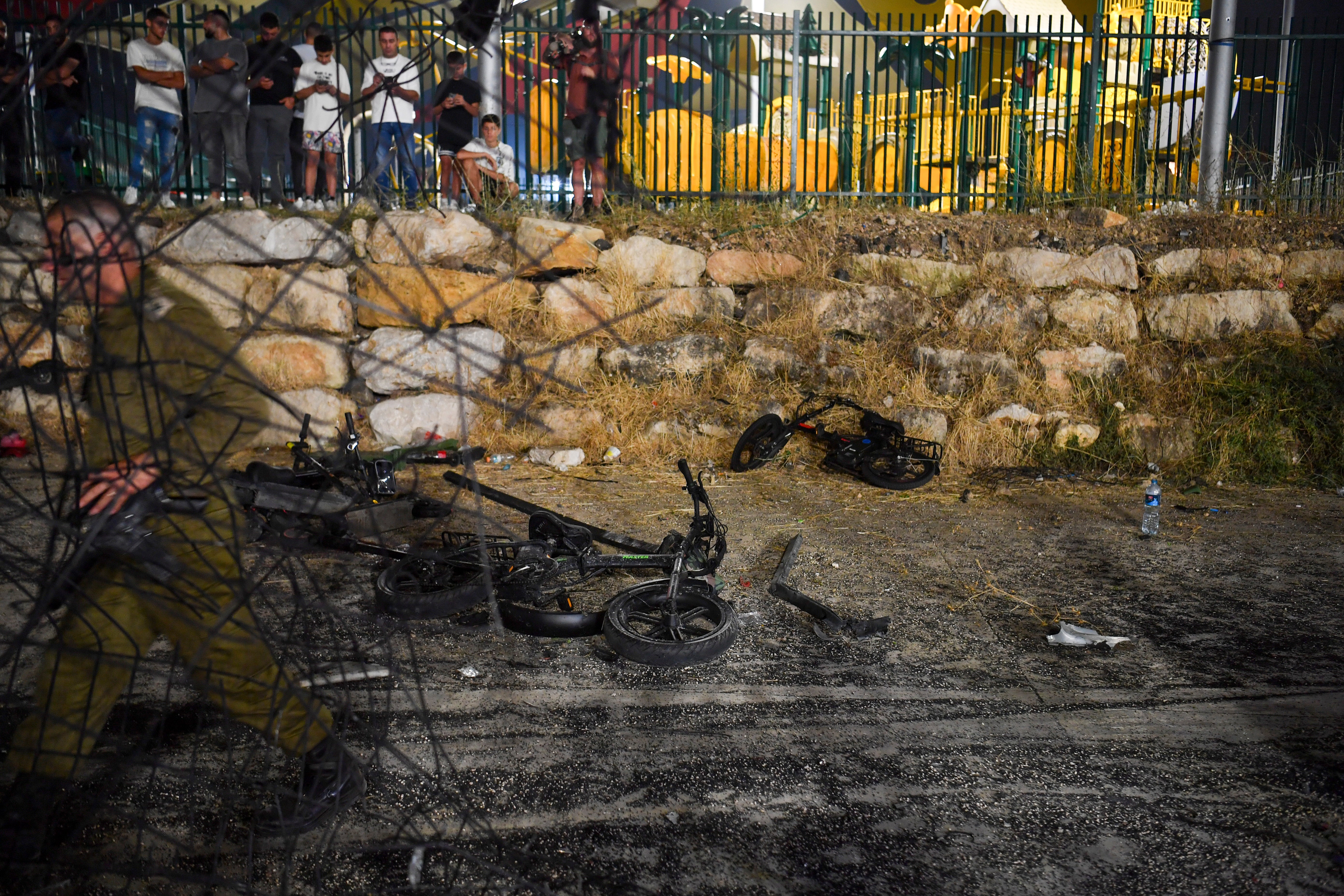 Destroyed children's bicycles at the site of a rocket attack in the Druze town of Majdal Shams, in the Israeli-controlled Golan Heights