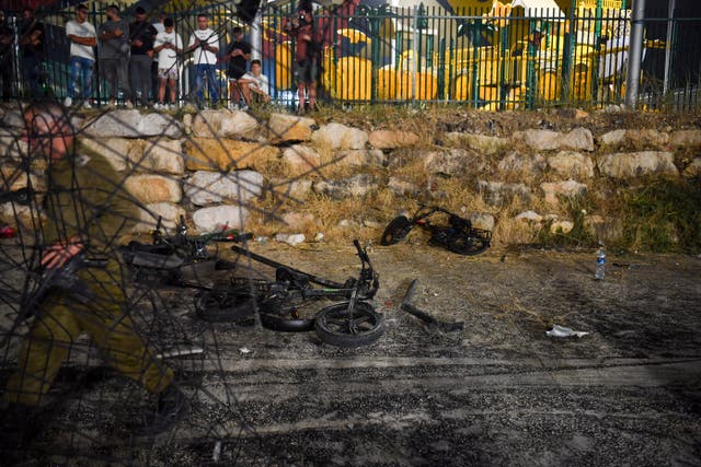 <p>Destroyed children's bicycles at the site of a rocket attack in the Druze town of Majdal Shams, in the Israeli-controlled Golan Heights</p>