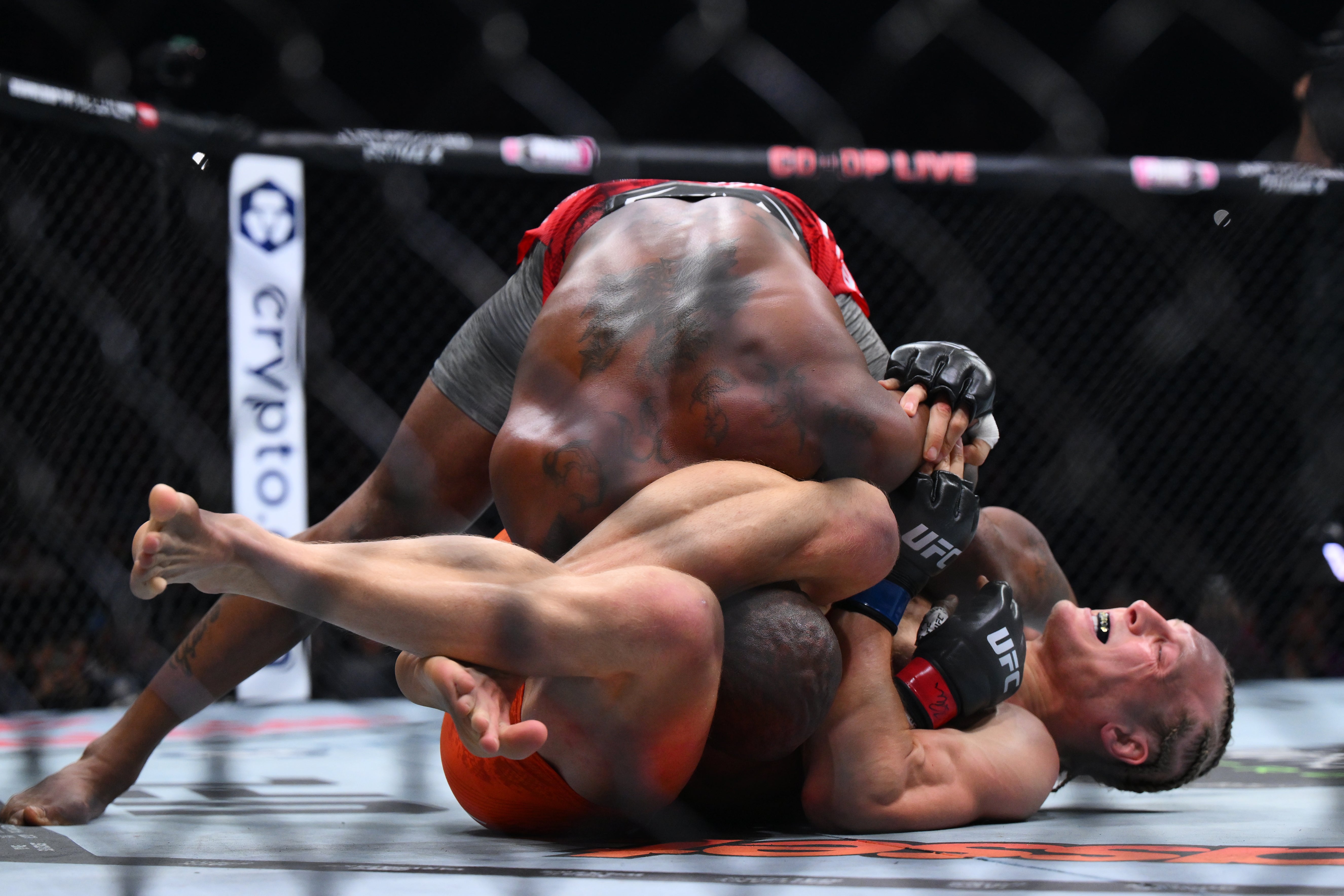 Paddy Pimblett (bottom) submits Bobby King Green with a triangle choke