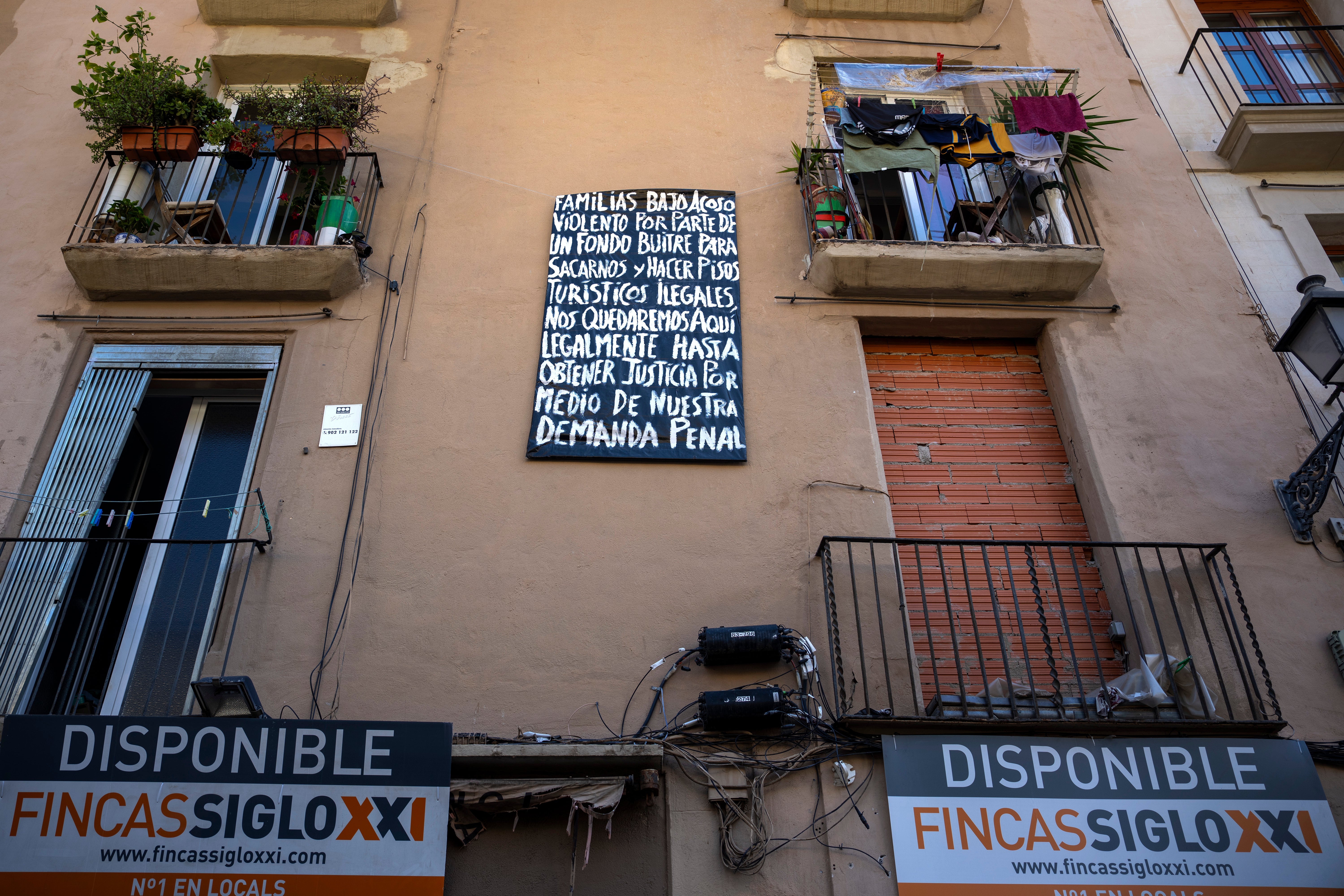 A block of flats, which is under threat of eviction, is photographed in downtown Barcelona, Spain, Wednesday, July 10