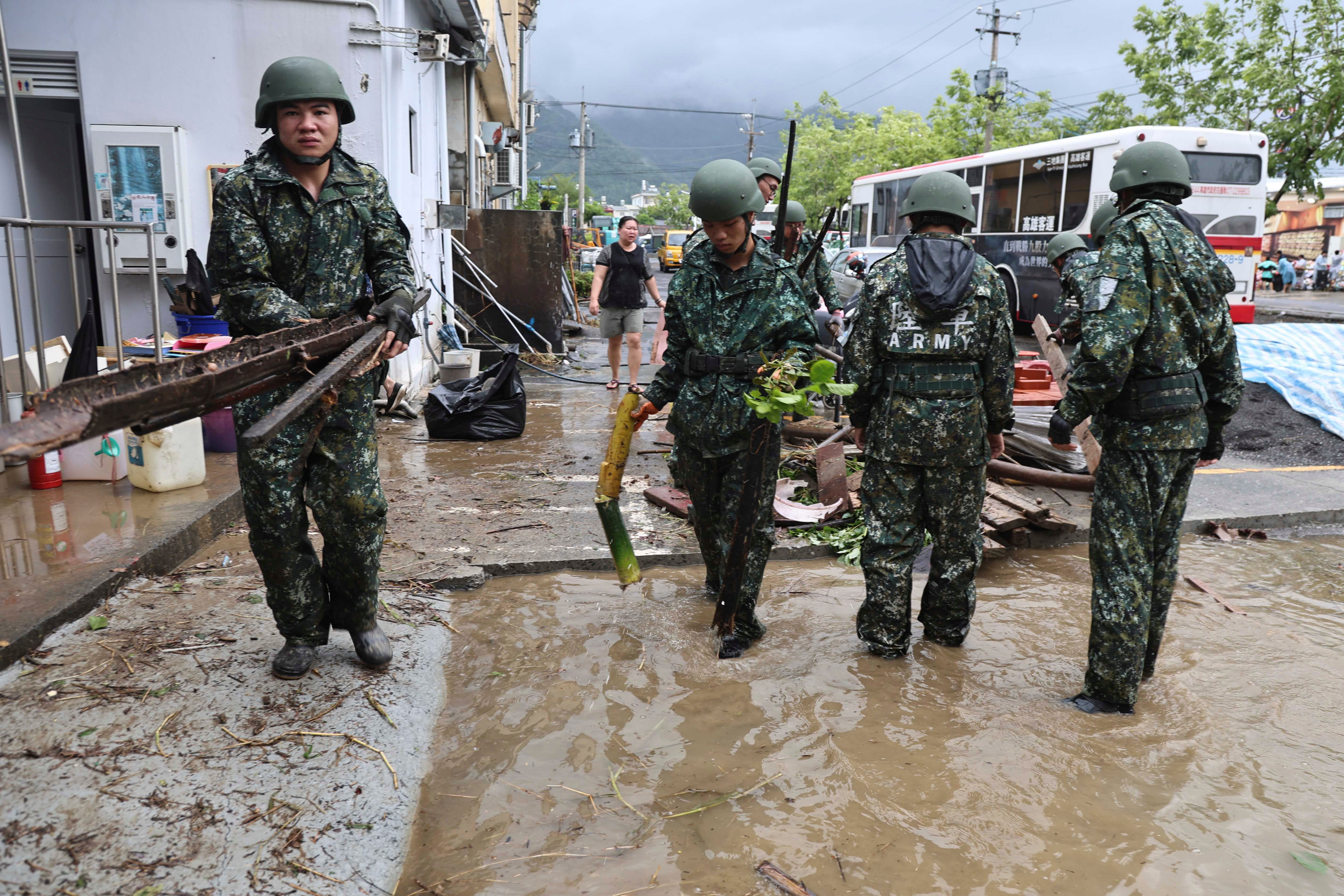 In this photo released by the Taiwan Ministry of National Defense, Taiwanese soldiers clear debris in the aftermath of Typhoon Gaemi in Kaohsiung county in southwestern Taiwan, Friday, 26 July 2024