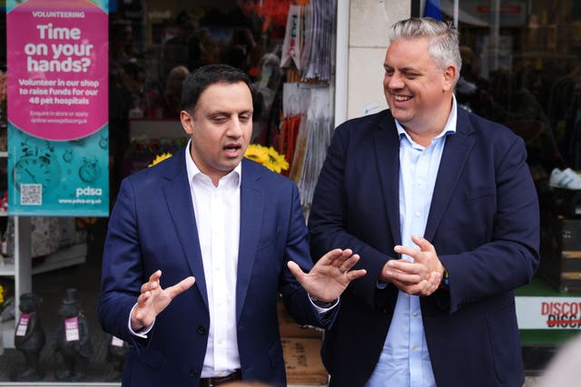 Scottish Labour leader Anas Sarwar alongside new MP Blair McDougall with activists on a walkabout in Clarkston, East Renfrewshire (Andrew Milligan/PA)