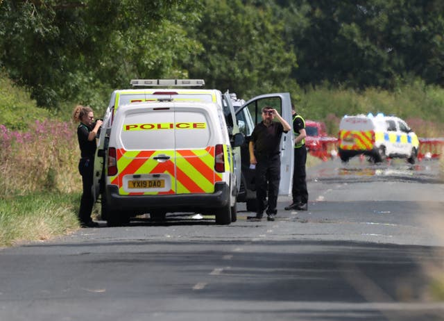 <p>Police near to the scene of an incident involving a light aircraft at Thorganby near York, in North Yorkshire</p>