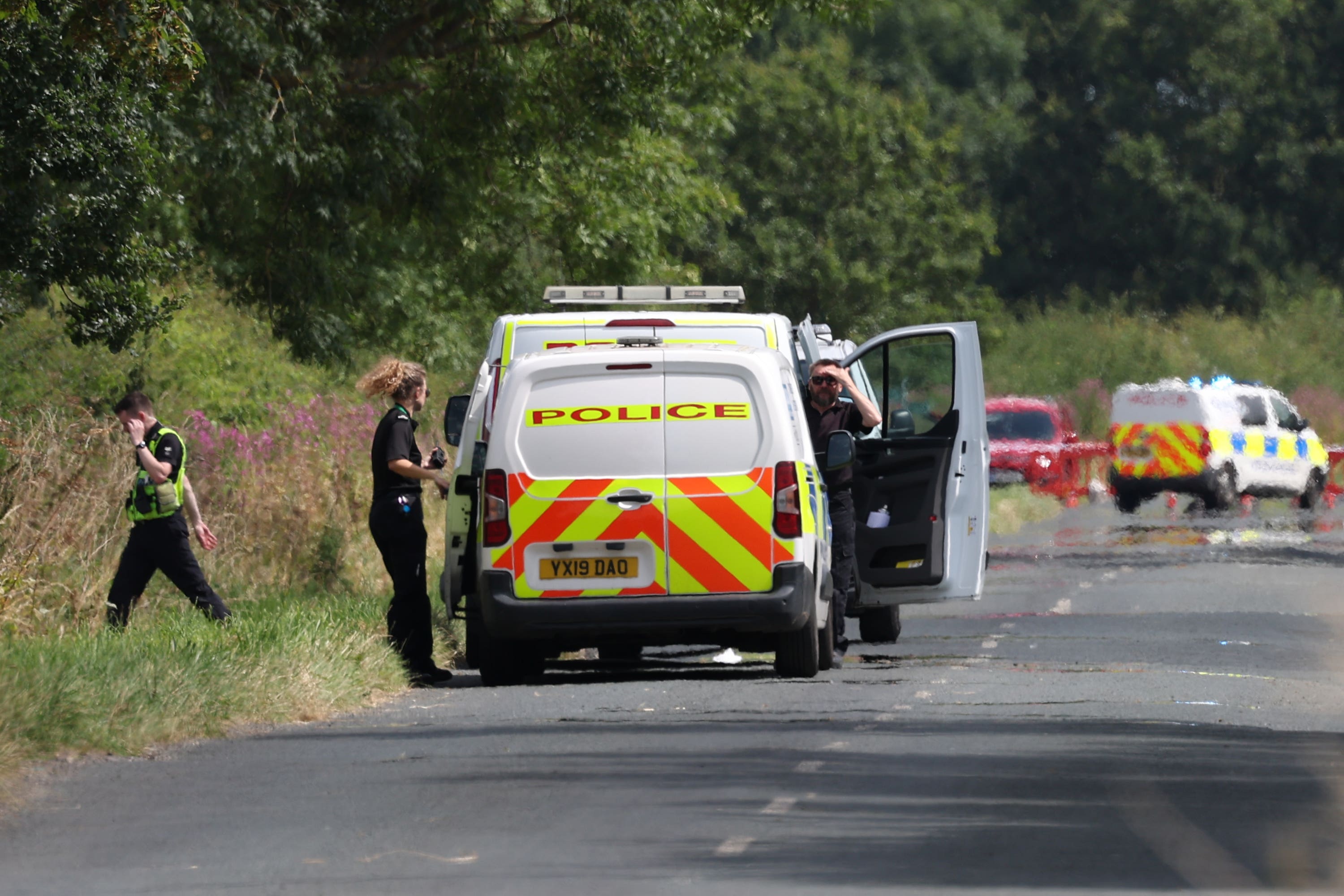 Officers could be seen near the scene of the crash (Nigel Roddis/PA)