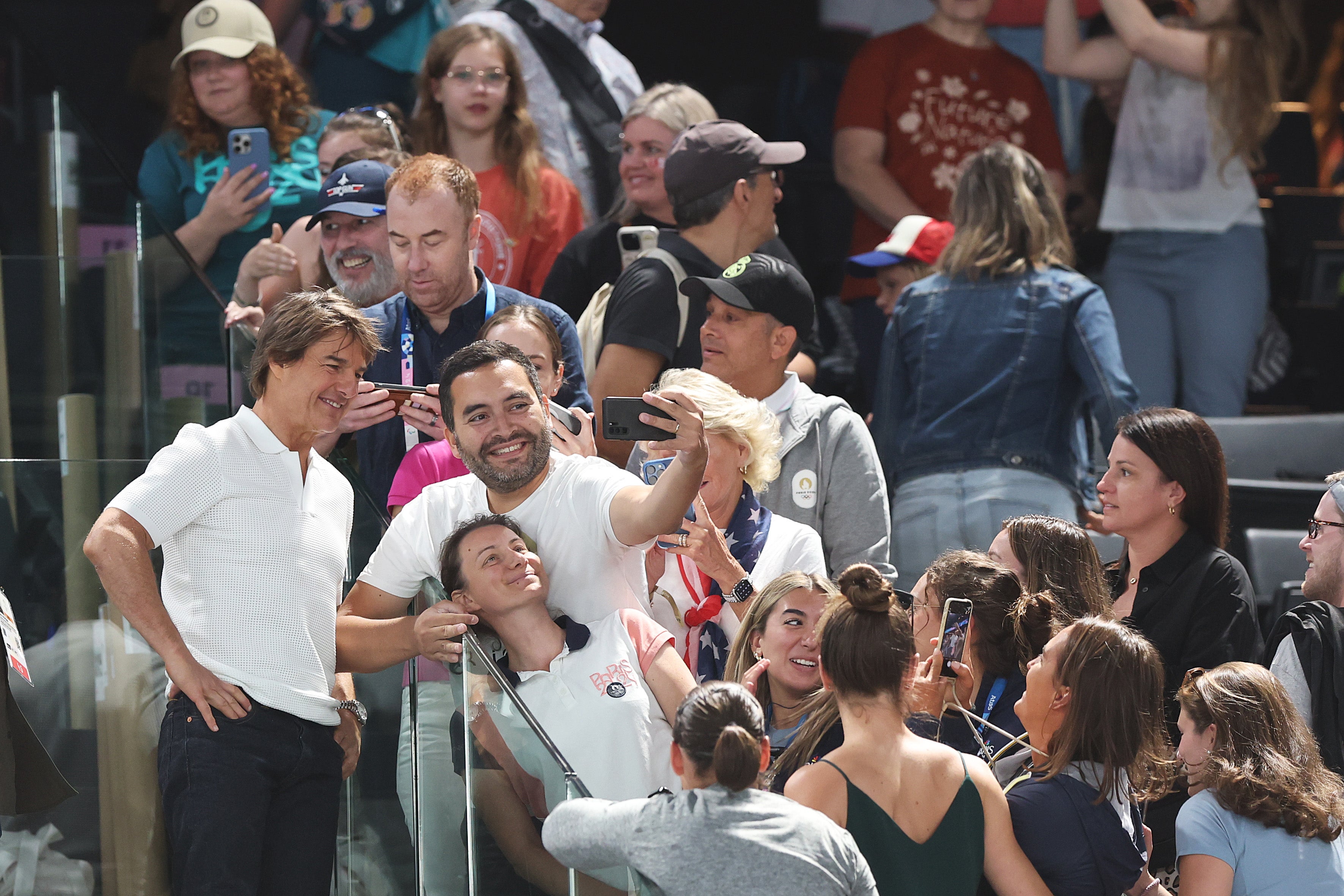 Tom Cruise poses for a selfie with fans