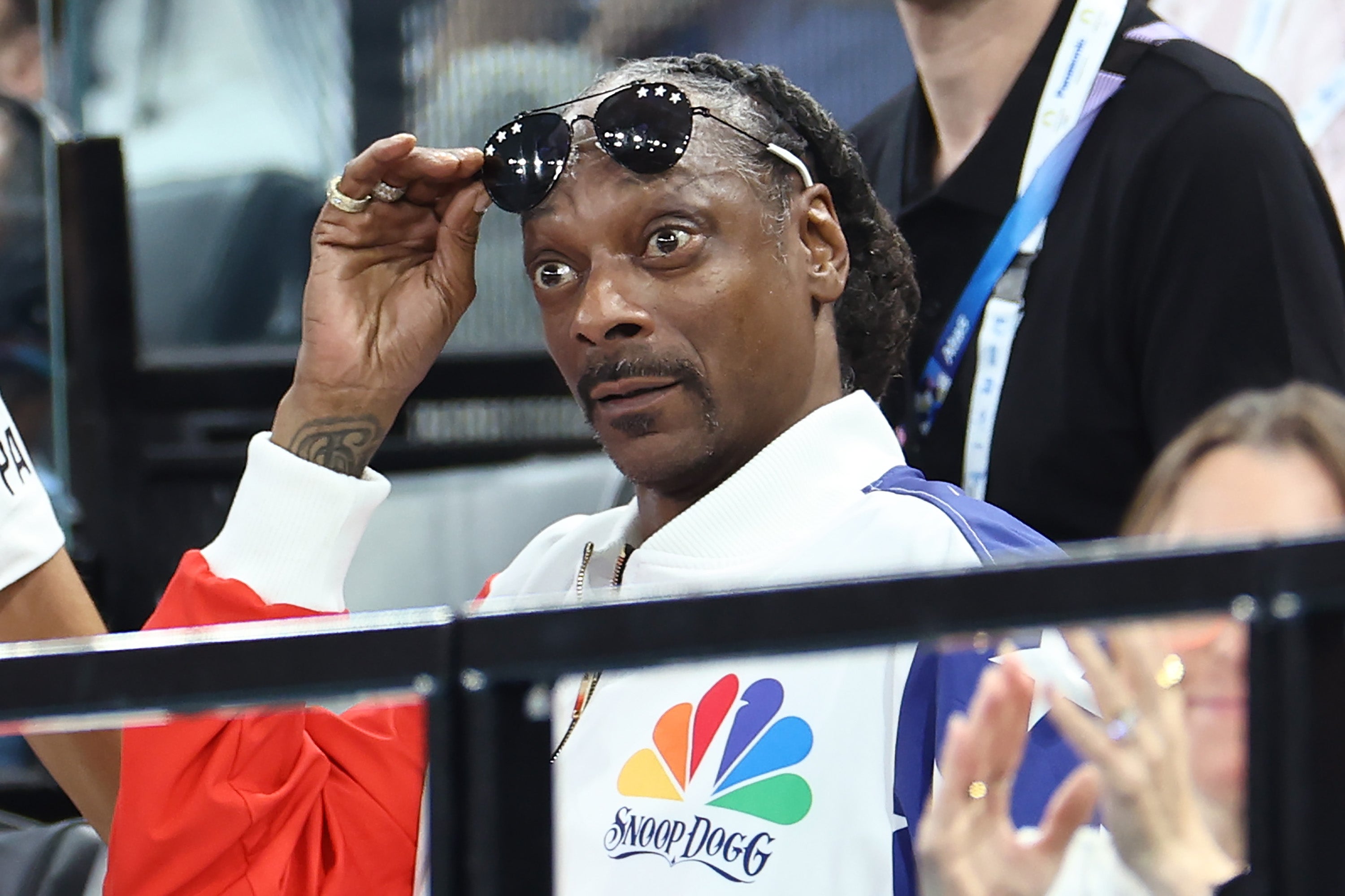 Snoop Dogg (R) attends the Artistic Gymnastics Women's Qualification