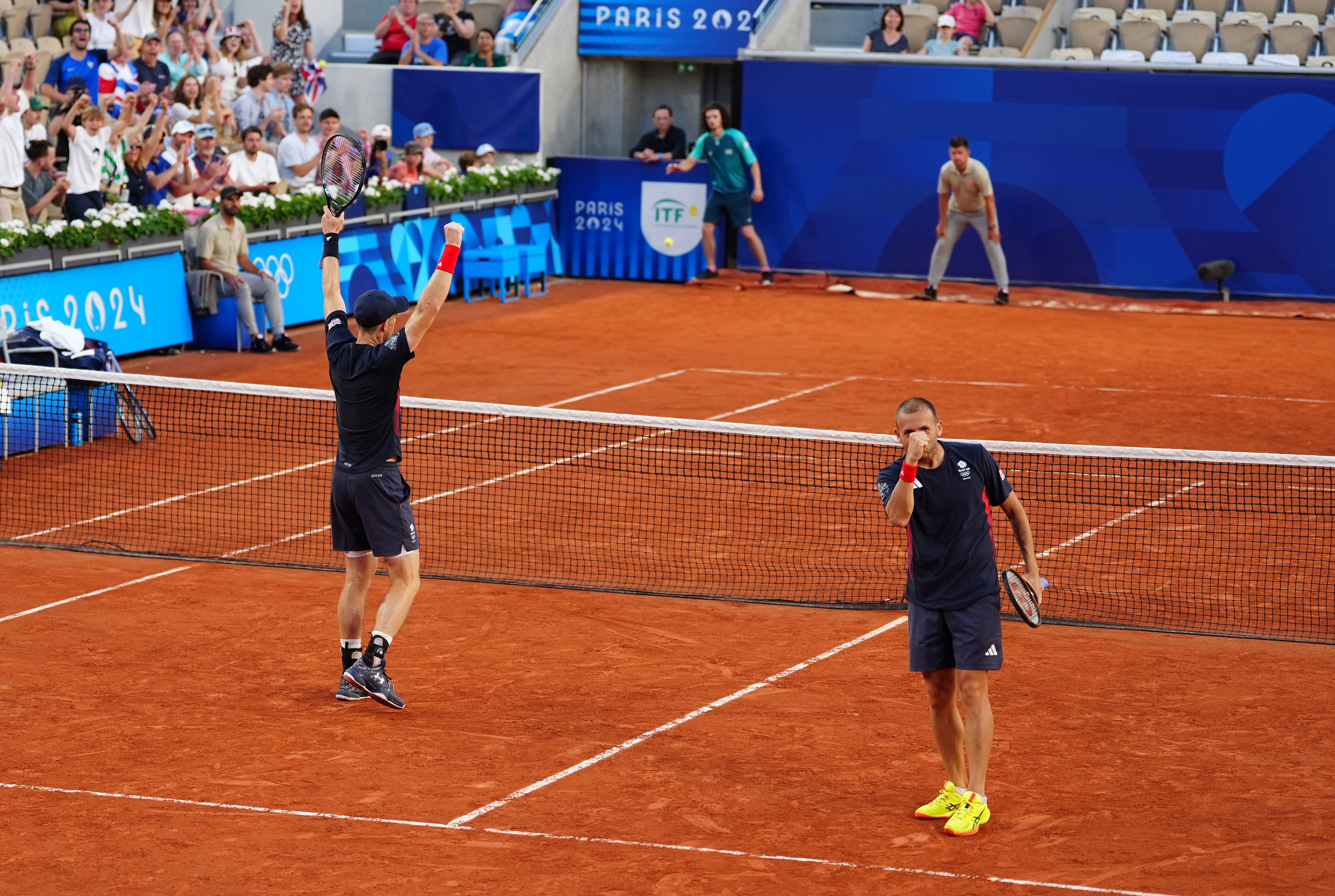 Andy Murray, left and Dan Evans react to their incredible victory (Peter Byrne/PA)