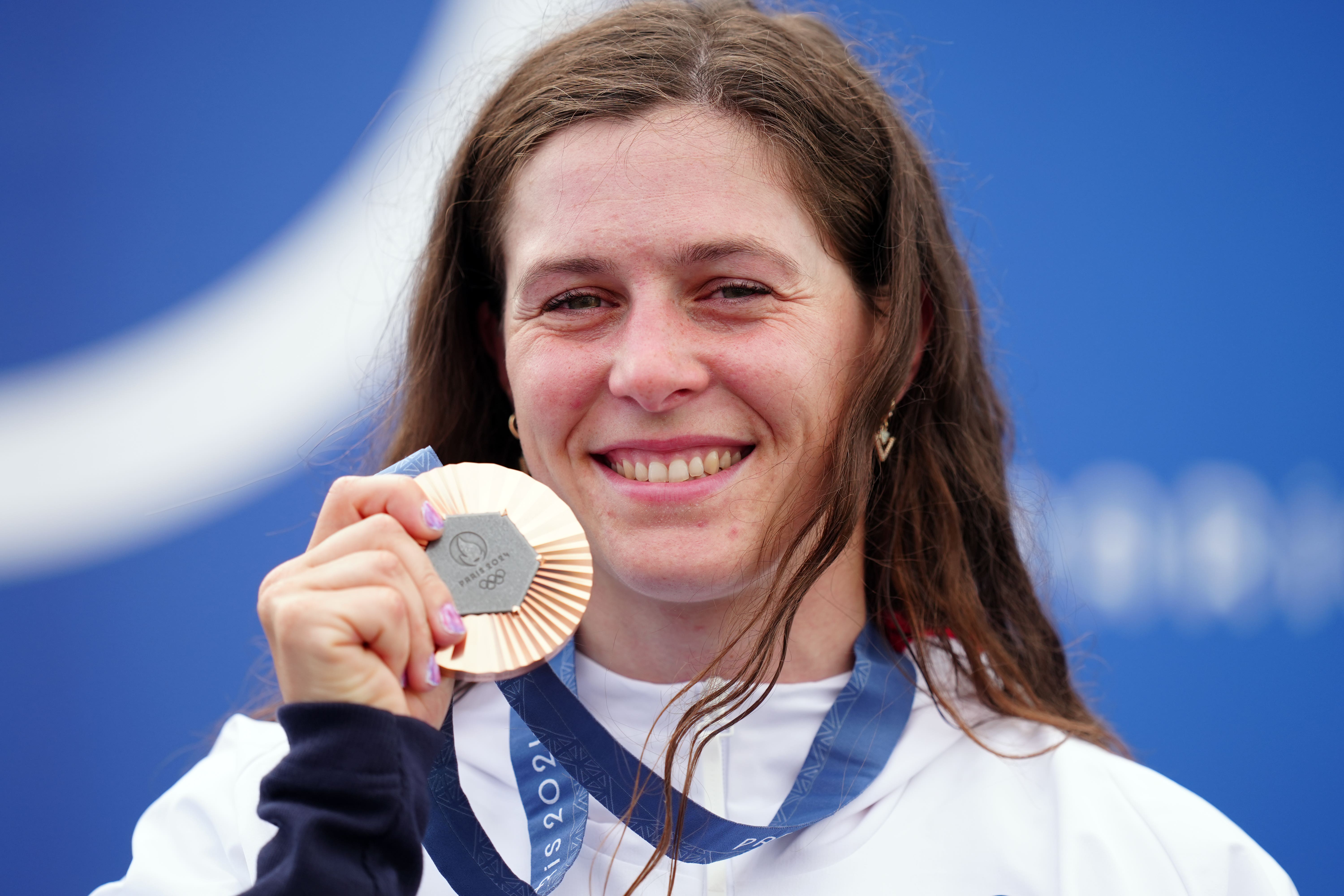 Great Britain’s Kimberley Woods celebrates with her bronze medal in the women’s kayak single at the Paris Olympics (David Davies/PA).