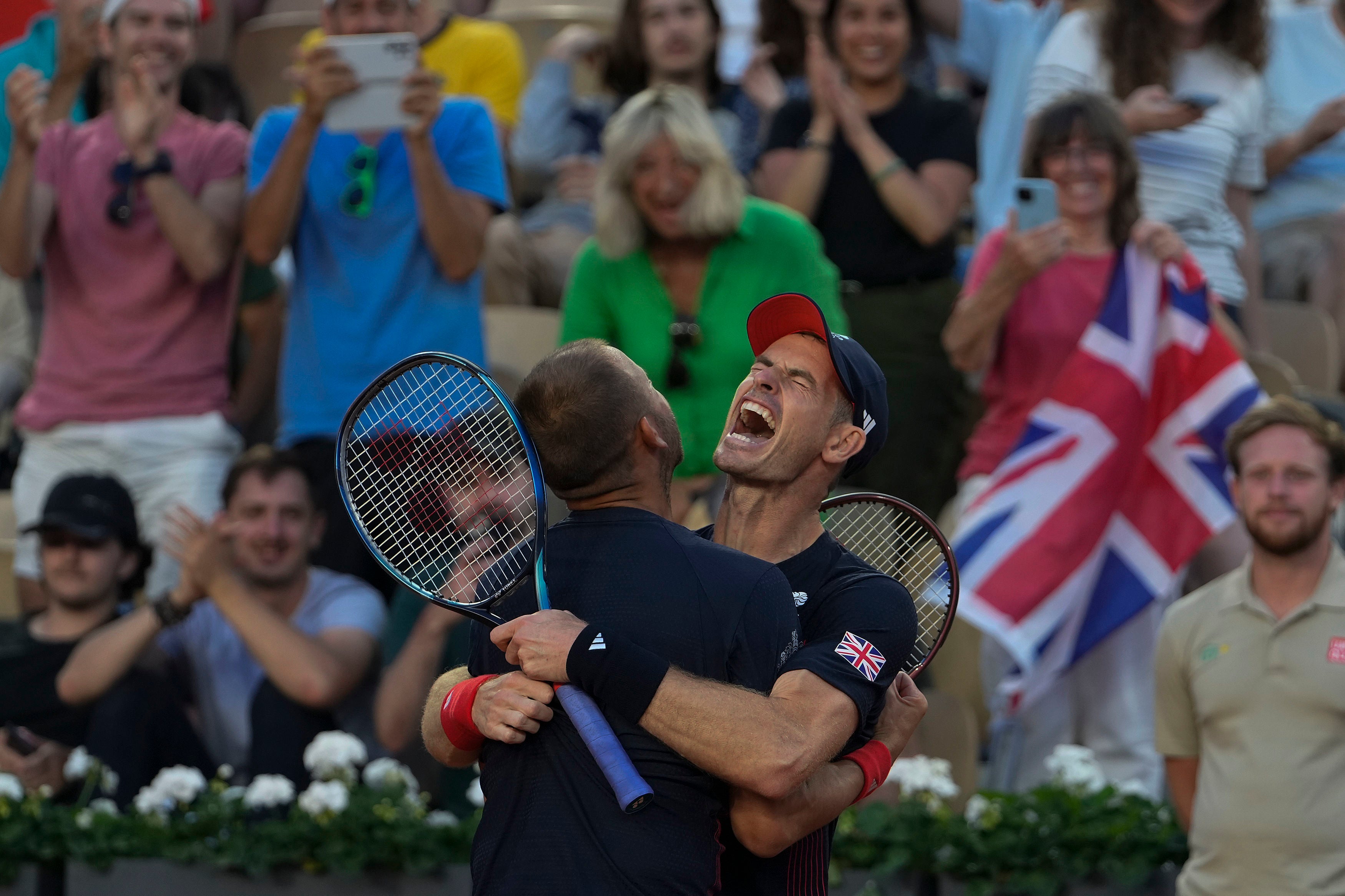 Andy Murray, right, and Dan Evans show their delight (Andy Wong/AP)