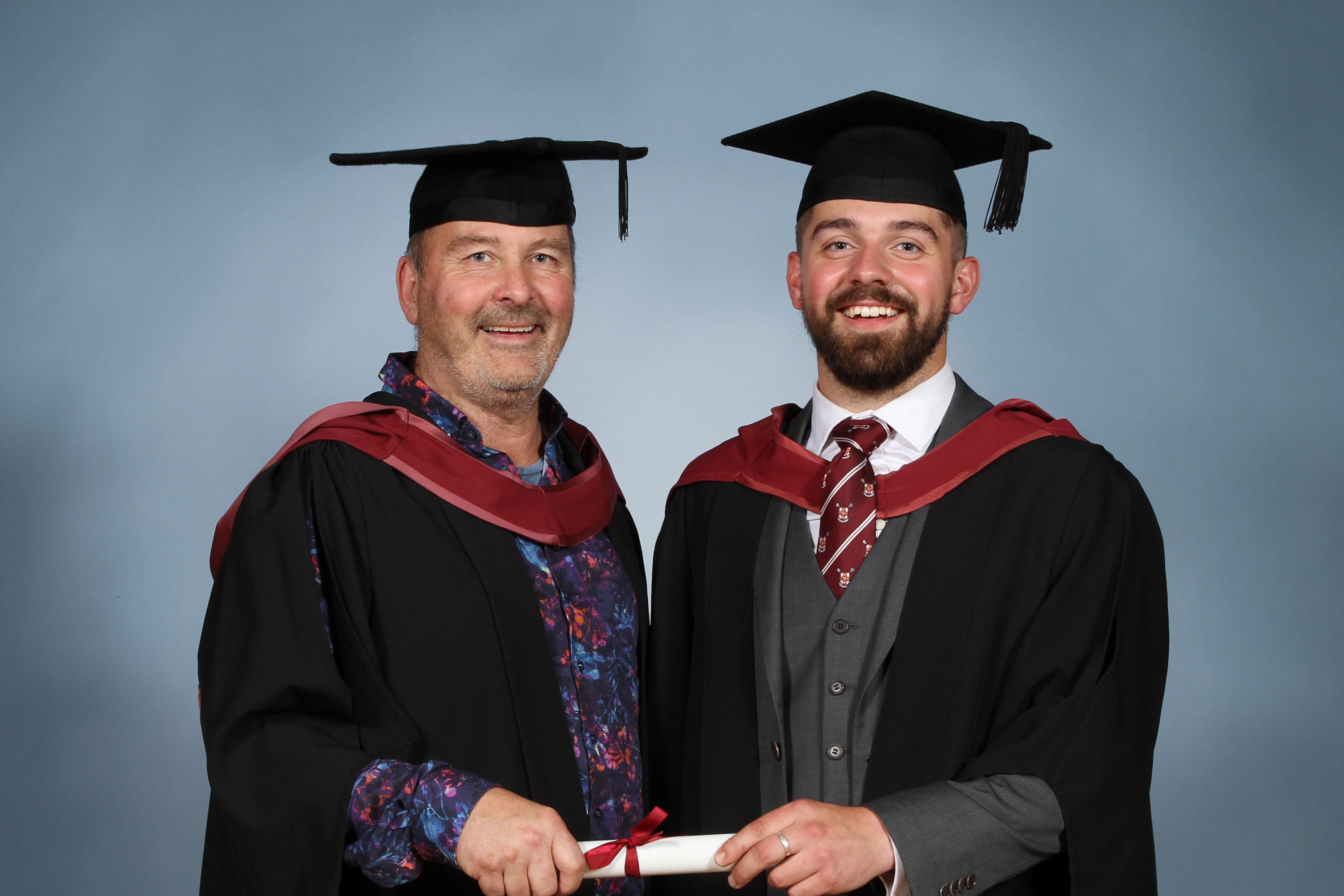 Jonny Clothier, 62, with his youngest son Carter, at their graduation on the same day at the University of Bristol (University of Bristol/PA)
