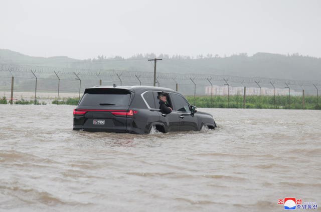 <p>North Korea’s leader Kim Jong-un looking out from a car as he inspects the area for flood damage after record-breaking heavy rains in the city of Sinuiju, North Pyongan province </p>