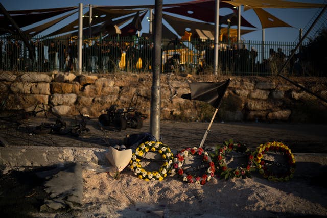 <p>Wreaths of flowers are placed on the site of a rocket strike that killed children and teenagers at a soccer field in the village of Majdal Shams, in the Israeli-annexed Golan Heights</p>