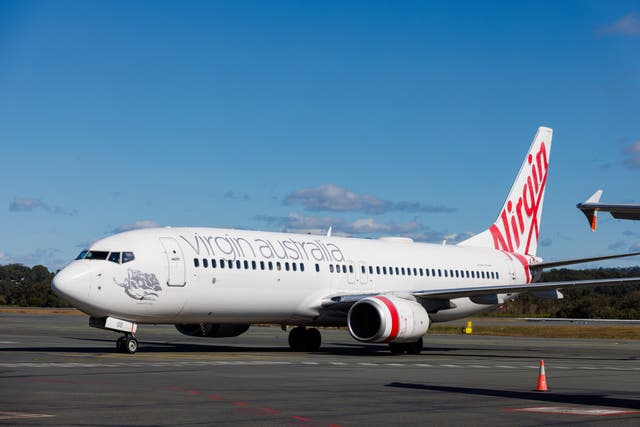 <p>Flight VA308 was met by paramedics at Tullamarine Airport</p>