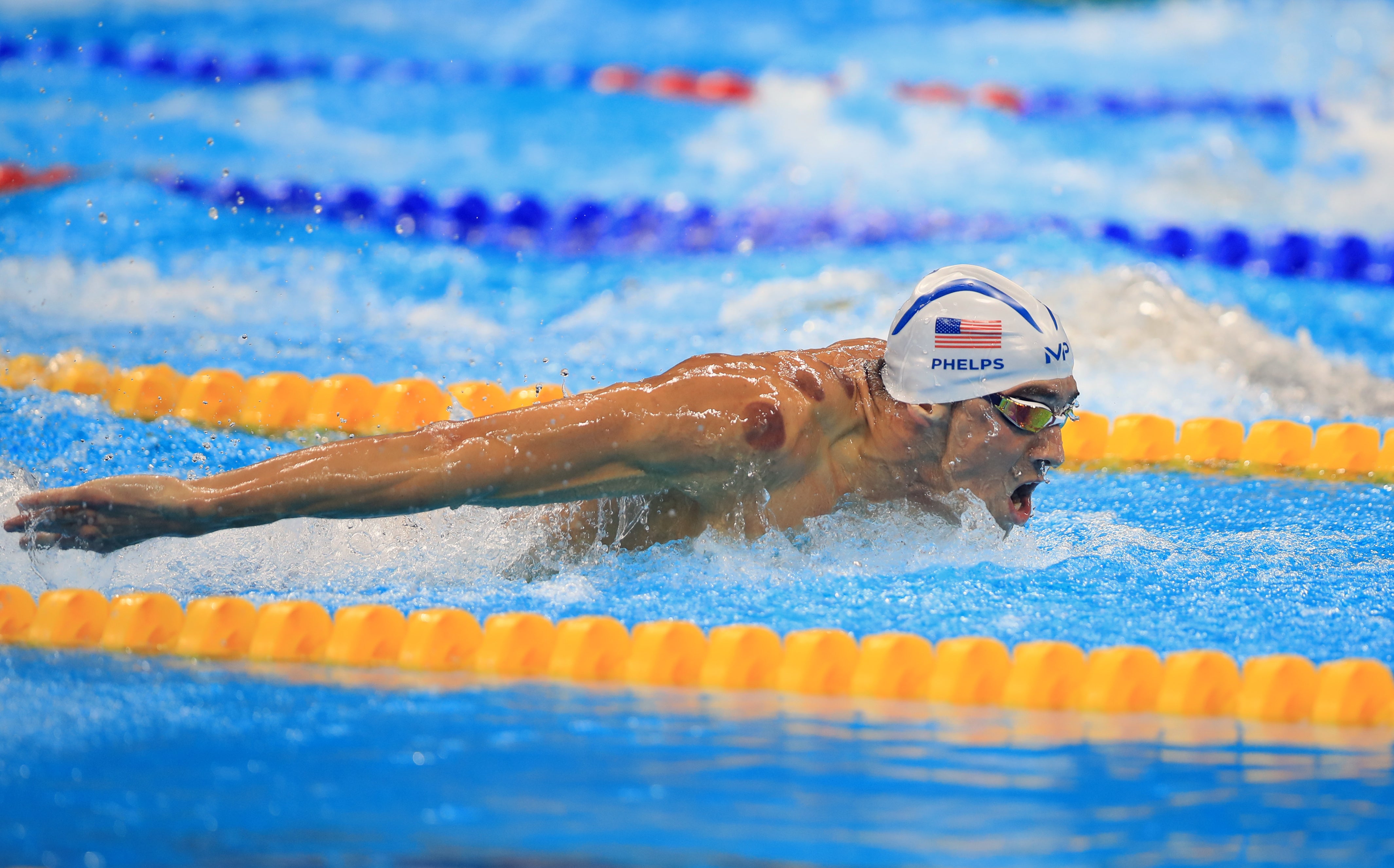 Michael Phelps was often seen in the pool with dark circular marks (Mike Egerton/ PA)