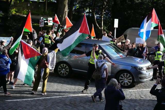 <p>Pro-Palestinian protesters as the car convoy carrying prime minister Keir Starmer</p>