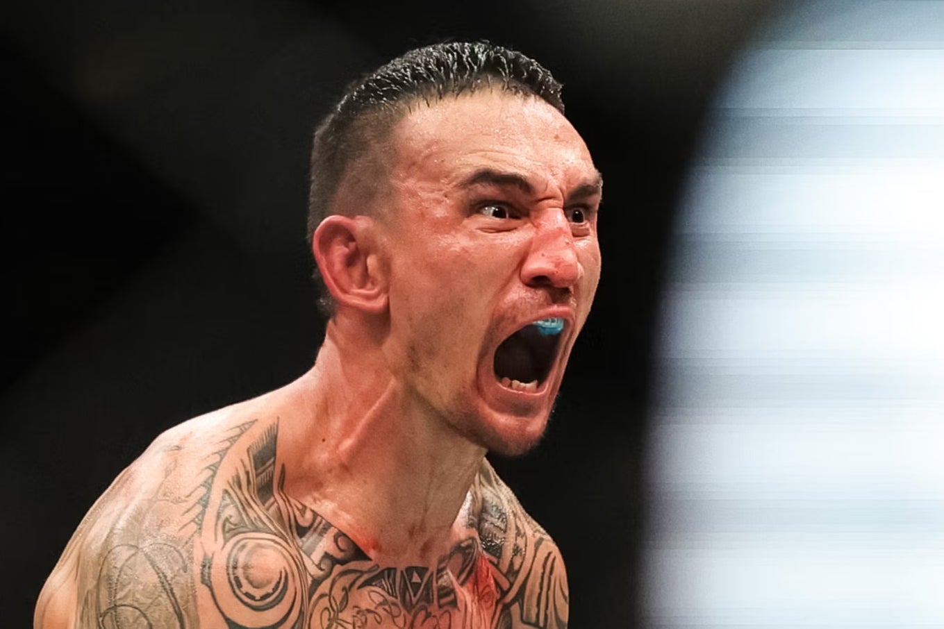 Max Holloway celebrates his knockout of Justin Gaethje at UFC 300