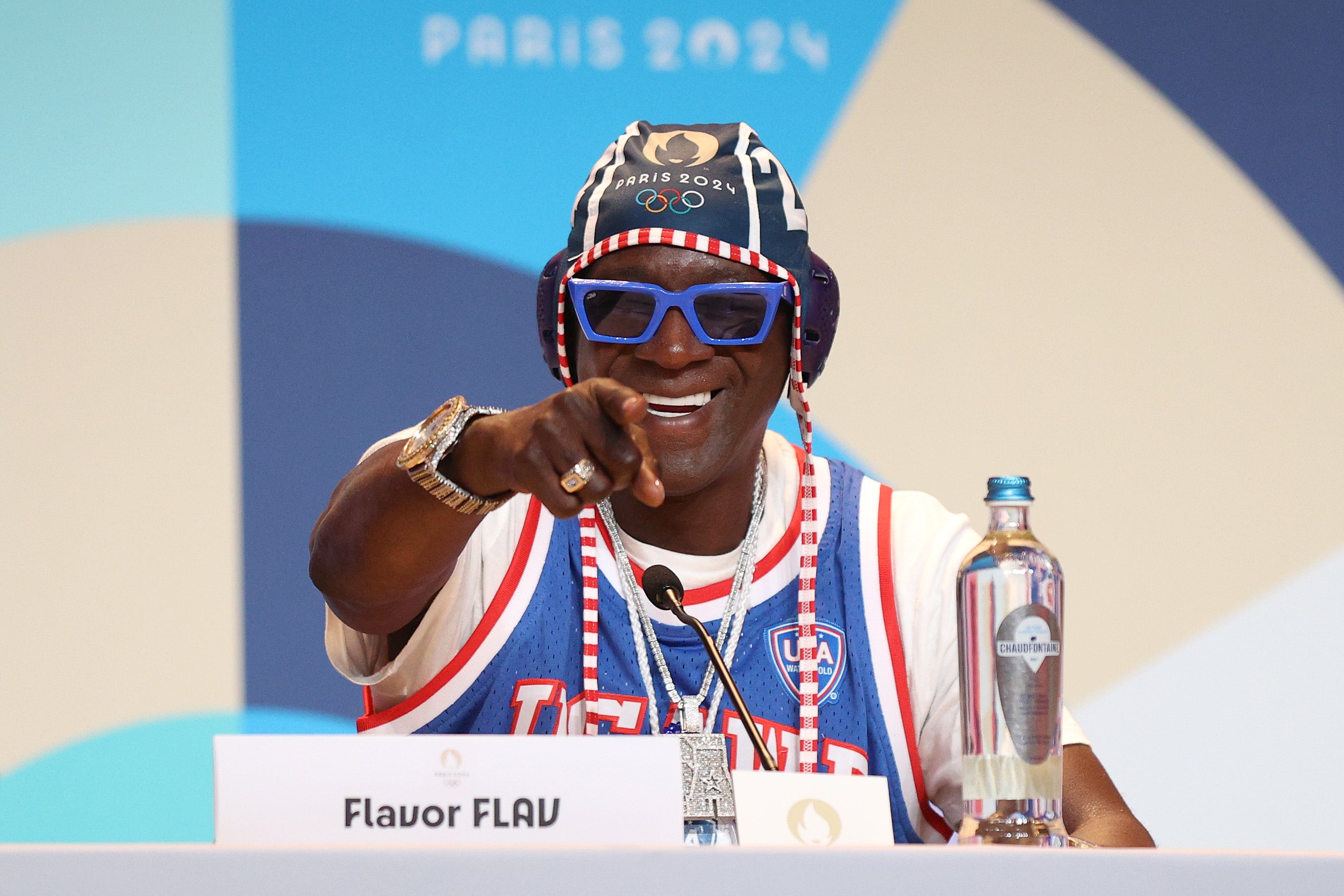 Flavor Flav speaks during a Team USA Water Polo press conference in Paris