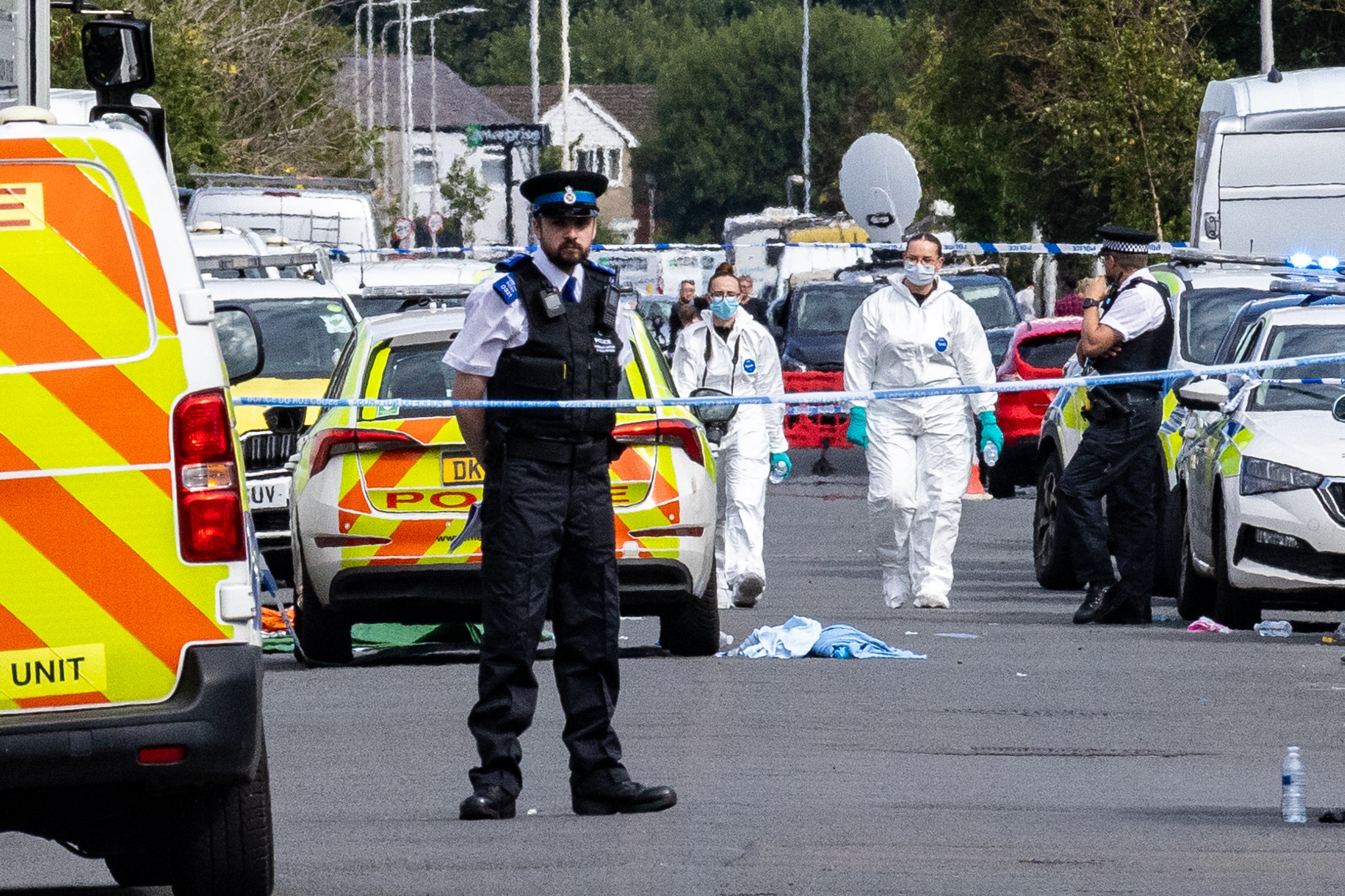 Forensic officers seen at the scene on Hart Street in the hours after the incident.