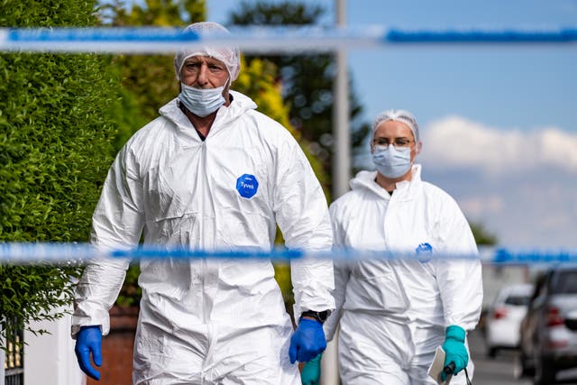 <p>Forensic officers at the scene </p>