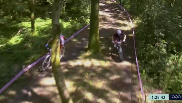 <p>Moment Tom Pidcock clips French rival’s wheel in risky overtake to secure mountain bike gold at Olympics.</p>