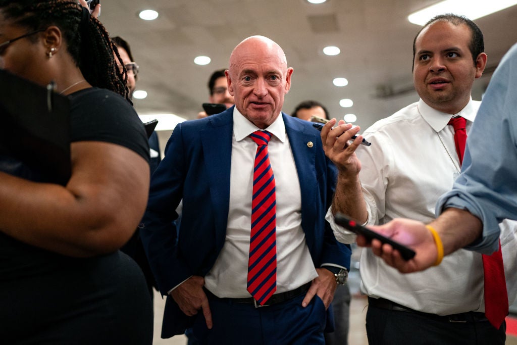 Arizona Senator Mark Kelly is surrounded by reporters on Capitol Hill on July 25 as speculation mounts indicating that he is on Kamala Harris’s VP shortlist