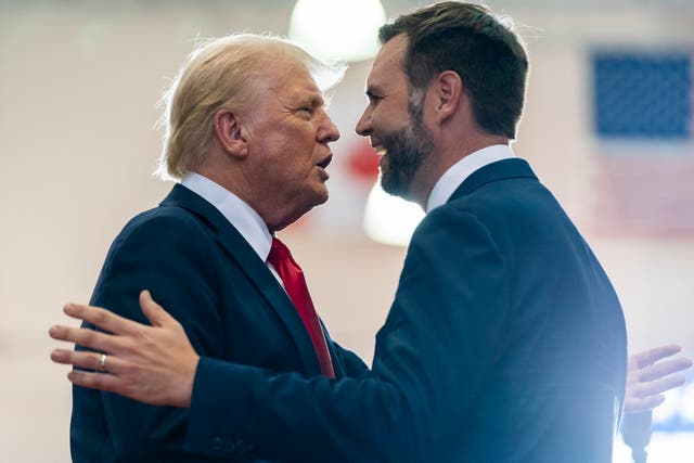 <p>Republican presidential candidate former President Donald Trump, left, greets Republican vice presidential candidate Sen. JD Vance, R-Ohio, before speaking at a campaign rally in Minnsota  </p>