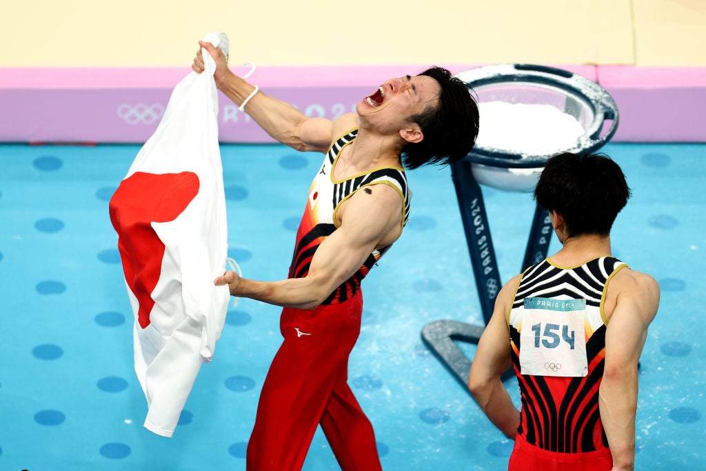 Kazuma Kaya and Hashimoto of Team Japan celebrate after winning gold