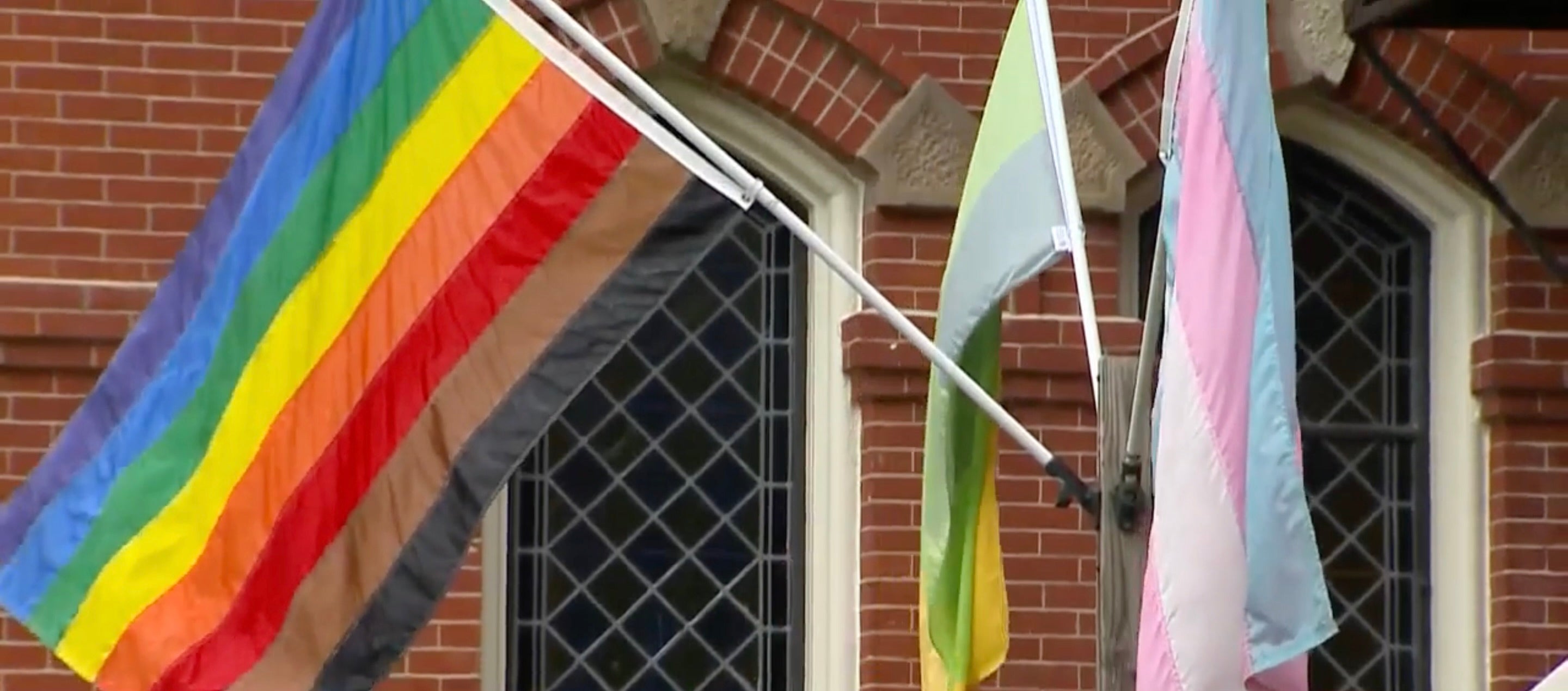 The Pride, transgender Pride and mental health awareness flags outside the First Congregational Church in Natick, Massachusetts. The church’s reverend said someone took down the flags on July 28