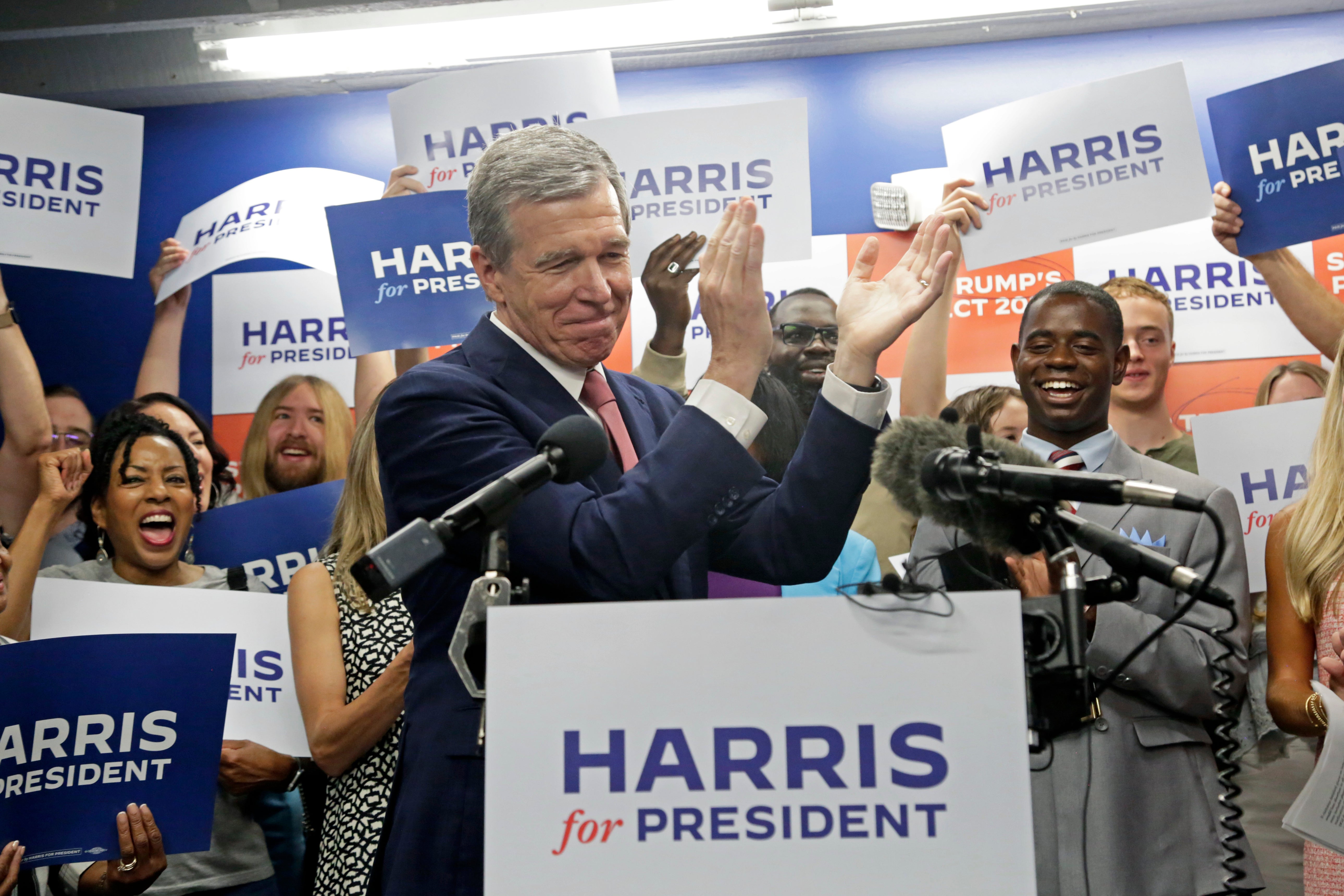 N.C. Governor Roy Cooper claps as he speaks at a news conference, Thursday, July 25, 2024, in Raleigh, N.C. Cooper had been considered a potential running mate for Harris