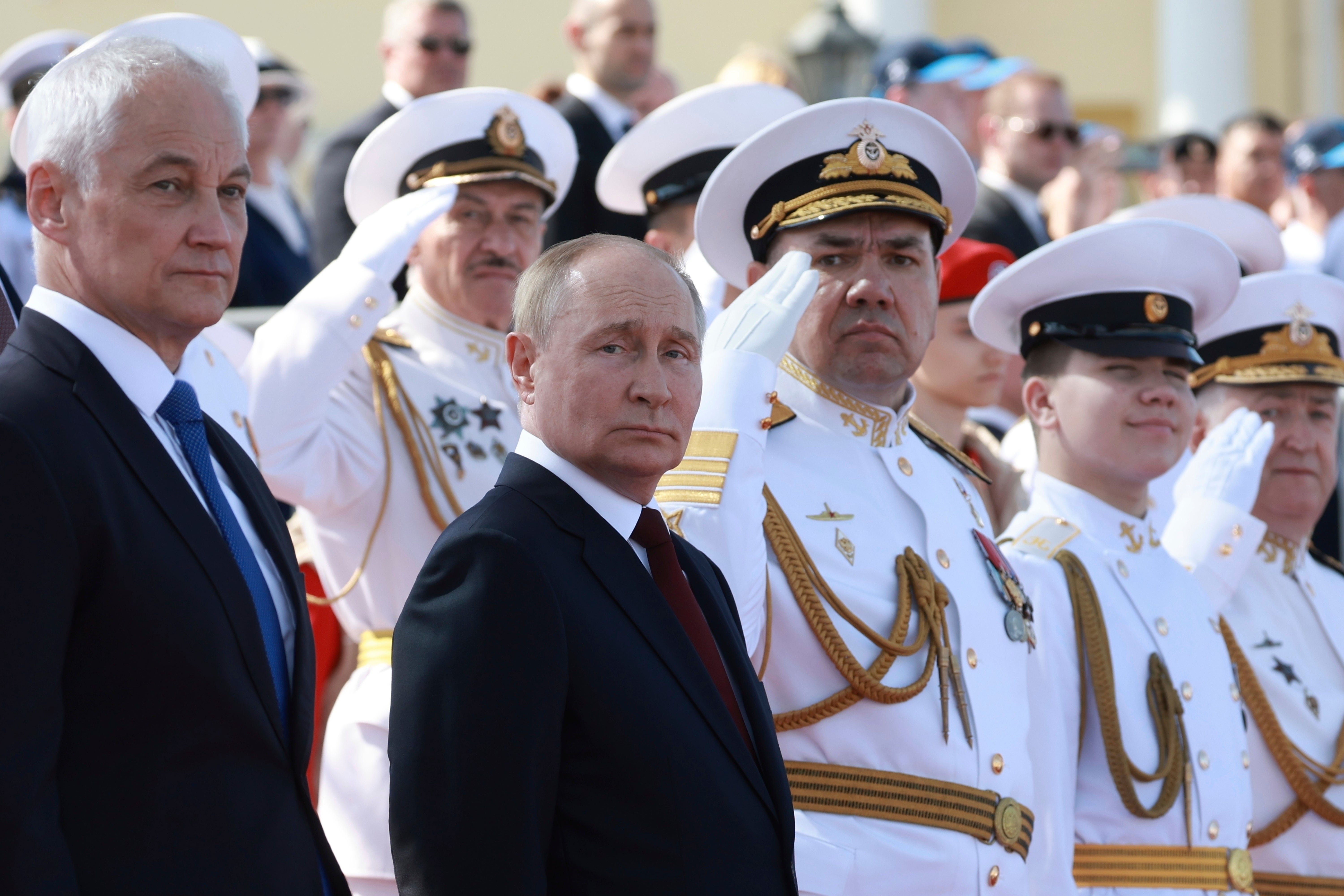 Vladimir Putin and defence minister Andrei Belousov attended the main naval parade in St Petersburg