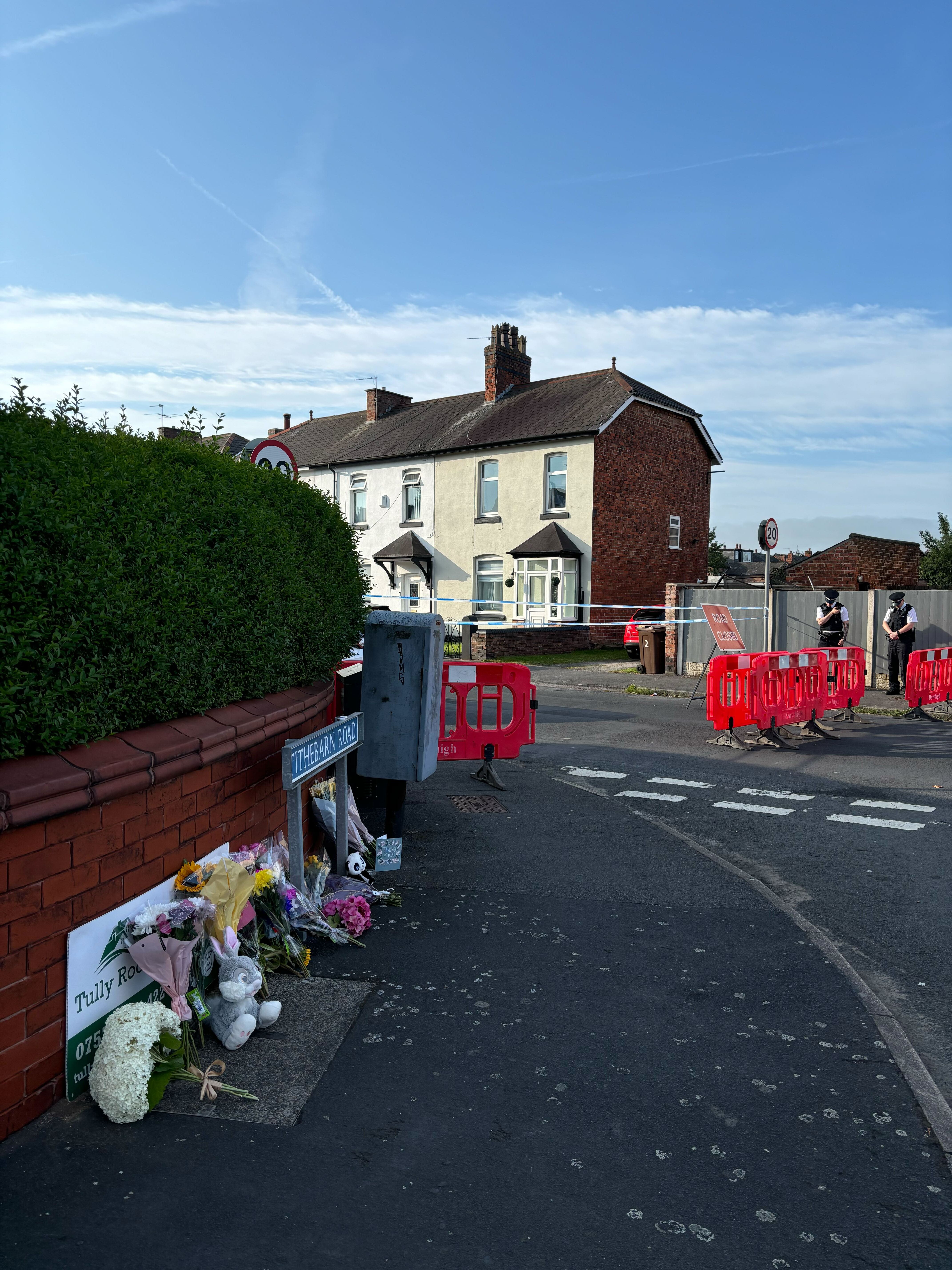 Floral tributes left close to the scene