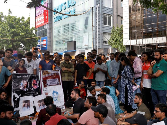 <p>Students protest outside a coaching centre in Delhi, India </p>