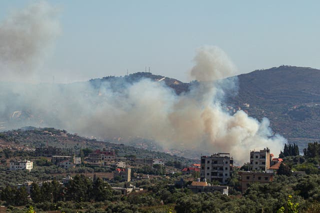 <p>Smoke billows from a site targeted by the Israeli military in the southern Lebanese border village of Kafr Kila on Monday</p>