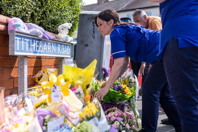 <p>People from the local community have gathered in Hart Street to pay tribute </p>