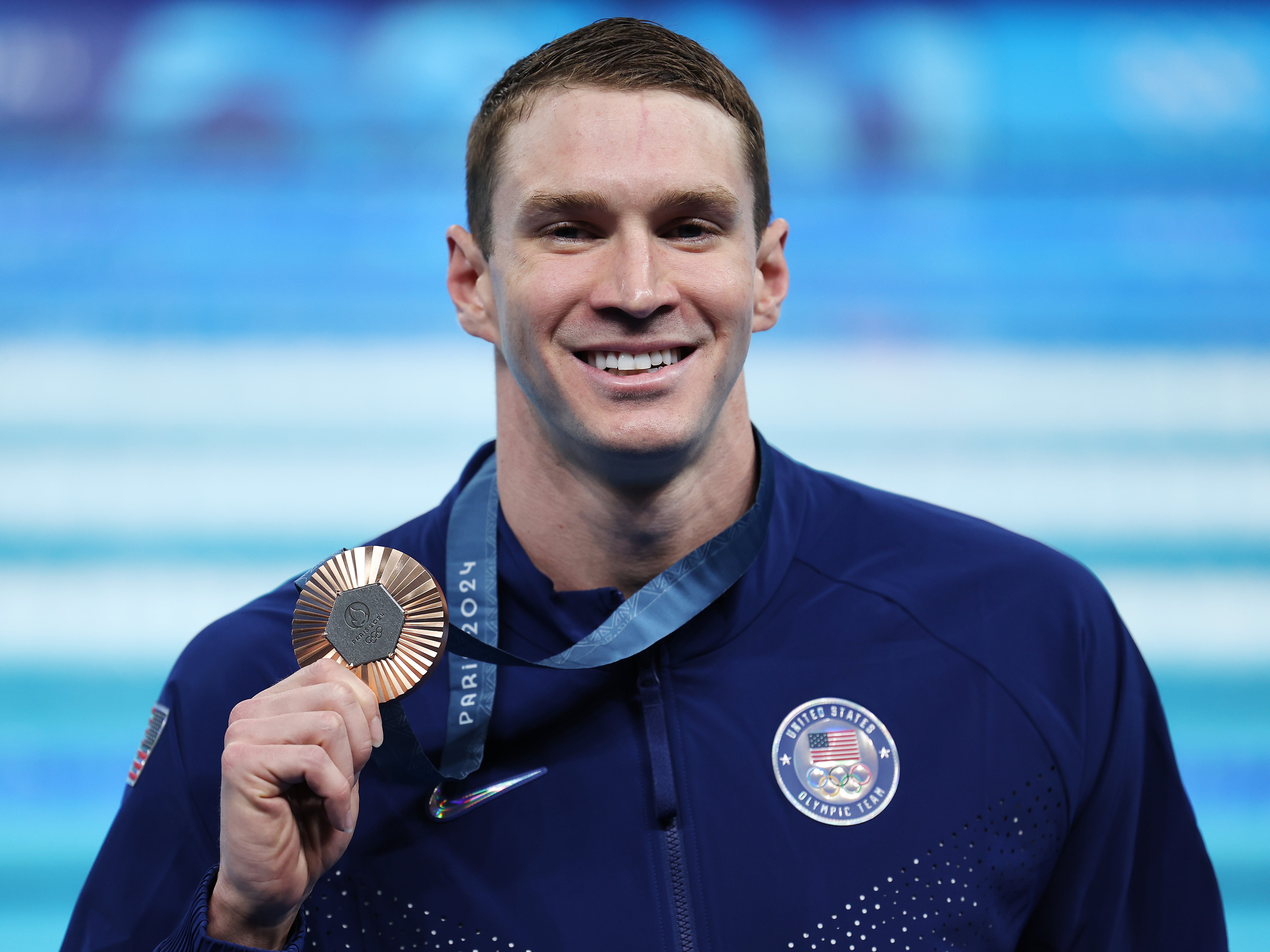 Bronze Medalist Ryan Murphy of Team United States poses following the Swimming medal ceremony after the Menâs 100m Backstroke Final on day three of the Olympic Games Paris 2024 at Paris La Defense Arena on 29 July 2024 in Nanterre, France (Quinn Rooney/Getty Images)