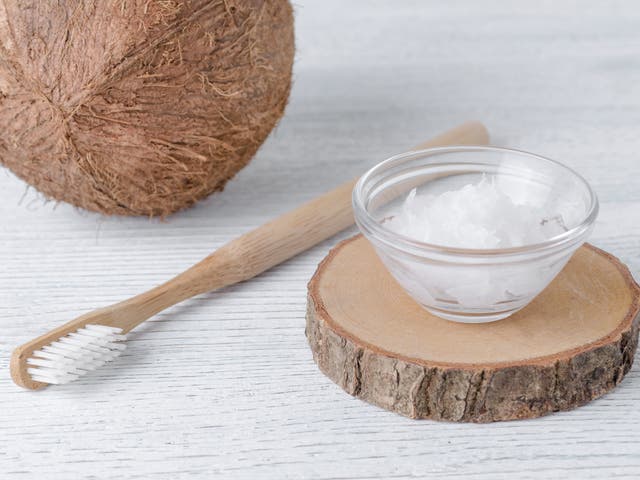 <p>Coconut oil is often used during ‘oil pulling’ – an oral hygiene hack with roots in Ayurvedic medicine</p>