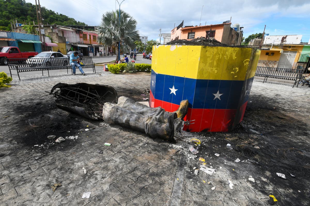 Hugo Chavez statues targeted across Venezuela in post-election unrest