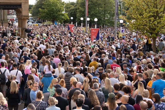 <p>Thousands came to lay flowers and pay tribute to the victims killed and injured </p>