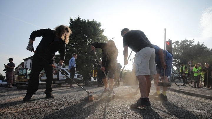 Volunteers in Southport came out to clean up the devastation on Wednesday morning after far right protesters clashed with police outside a mosque