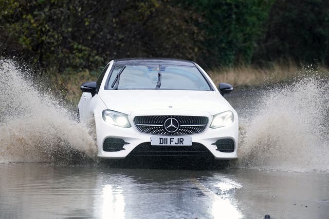 The Highway Code says stopping distances in wet weather are ‘at least double’ compared with dry conditions as tyres have less grip on the road (Owen Humphreys/PA)