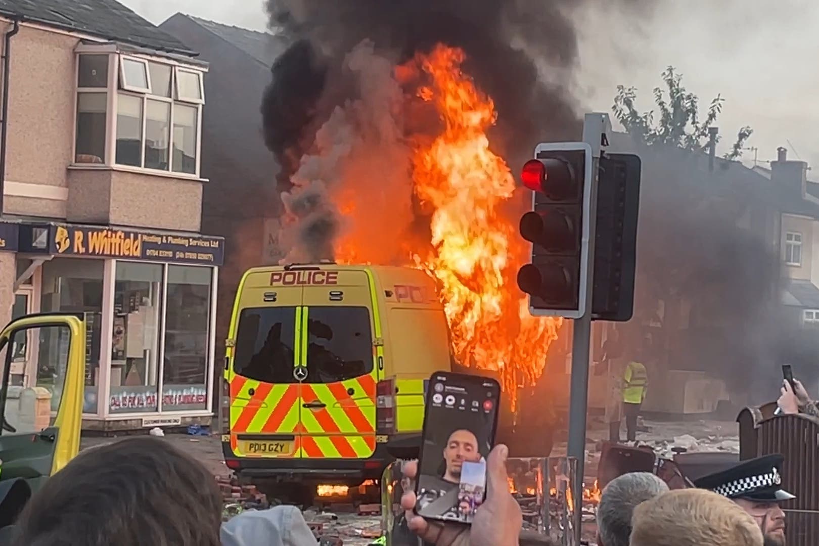 Police officers suffered serious injuries when bricks, stones and bottles were thrown and cars were set alight during violent protests in Southport following a vigil for three girls killed in a knife attack at a Taylor Swift-themed holiday club (Richard McCarthy/PA)