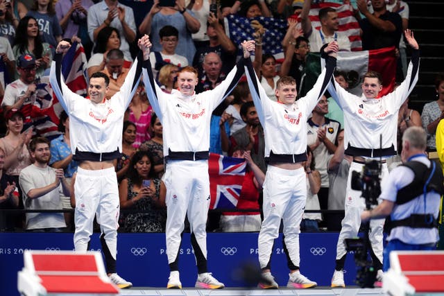 Great Britain’s James Guy, Tom Dean, Matt Richards and Duncan Scott celebrate winning 4x200m freestyle relay gold (John Walton/PA)