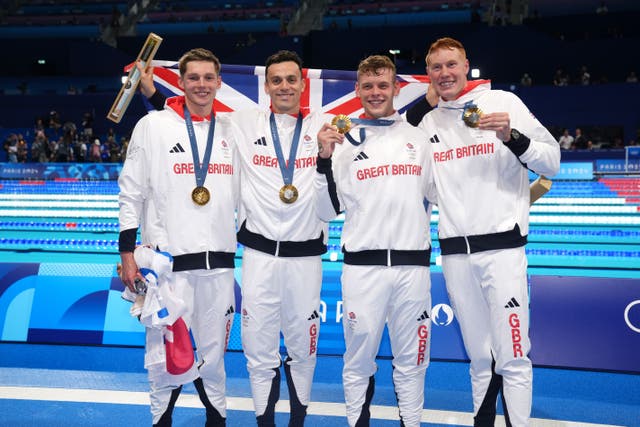 Duncan Scott, left, James Guy, Matt Richards and Tom Dean sealed Tram GB’s first Olympic gold in the pool at Paris 2024 (John Walton/PA)