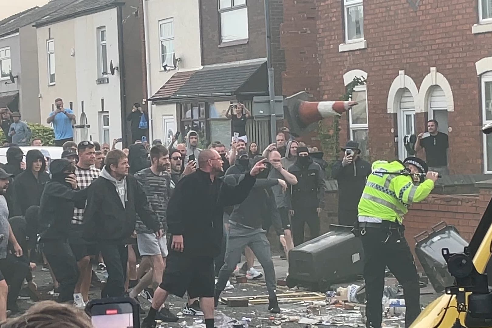 Rioters clash with police during a protest in Southport on Tuesday evening