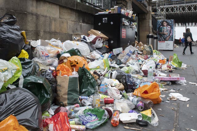 Waste workers in Scotland are to go on strike for eight days in August (PA)