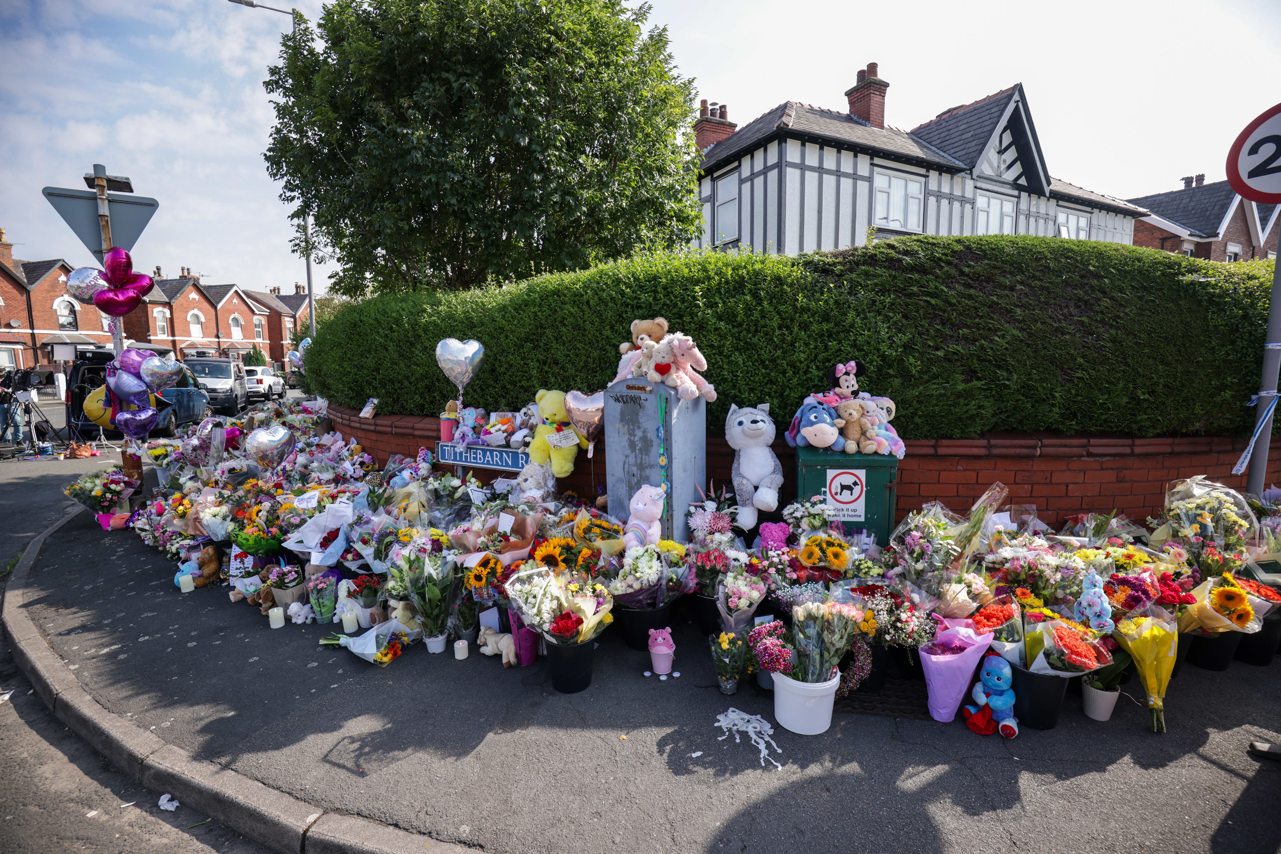 Floral tributes on the junction of Tithebarn Road and Hart Street in Southport, near the scene where three children were fatally stabbed at a Taylor Swift-themed holiday club on Monday (James Speakman/PA)